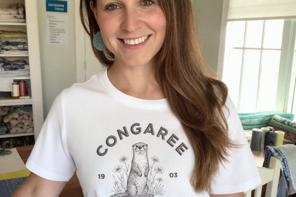 lifestyle scene ~ Congaree National Park ~ Otter, Stitchin In Beauty ~ Comfort Color Premium Tee ~ Chic Quilter