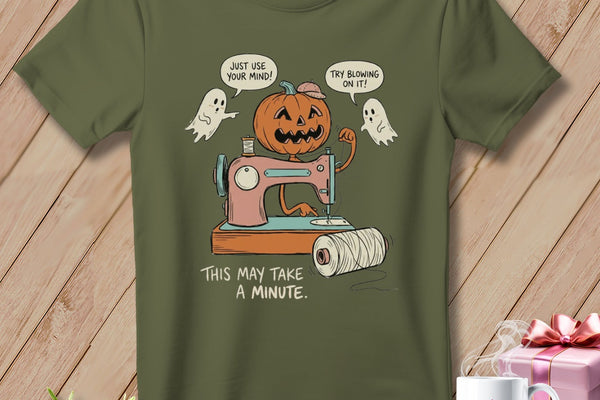 Pumpkin on sewing machine with ghosts