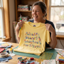A laughing quilter holding a seam ripper and the Afraid Seam? Laughed the Ripper premium tee