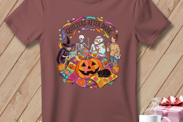 T-shirt with Halloween quilting theme featuring a witch, skeleton, mummy, and pumpkins.