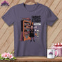 T-shirt graphic of a witch by a fabric stash with text: 