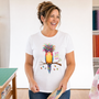 A quilter smiling in her sewing room, wearing the Quilt Hair Don't Care tee