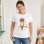A quilter at her cutting table wearing the Quilt Hair Don't Care tee