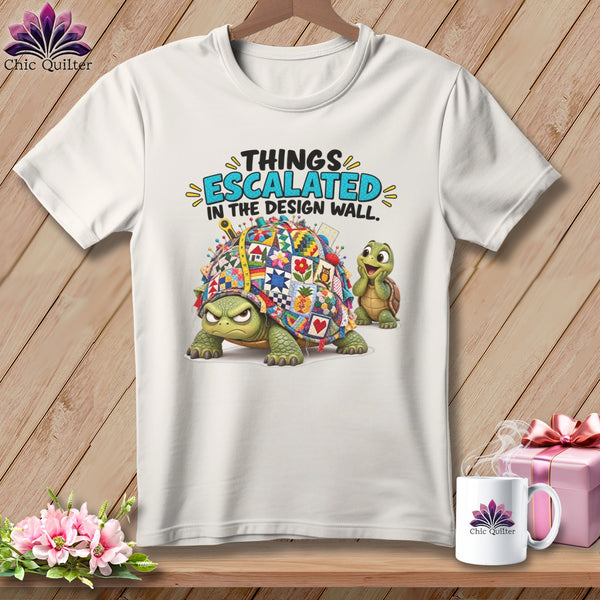 White t-shirt with cartoon turtles and "Things Escalated in the Design Wall" text.