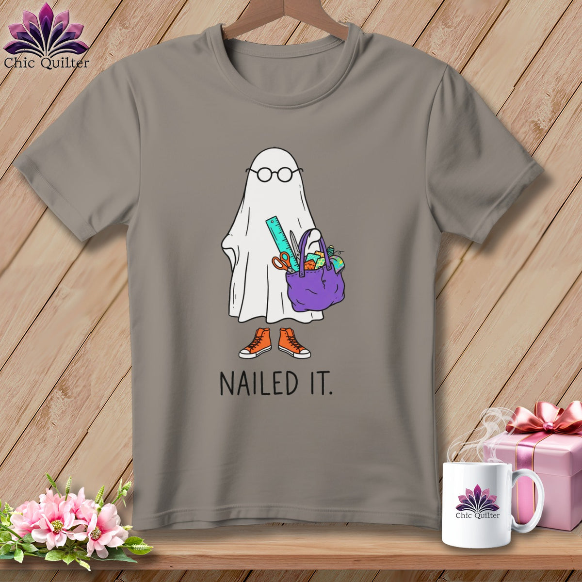 Ghost with glasses and craft bag on a gray t-shirt with text "NAILED IT."