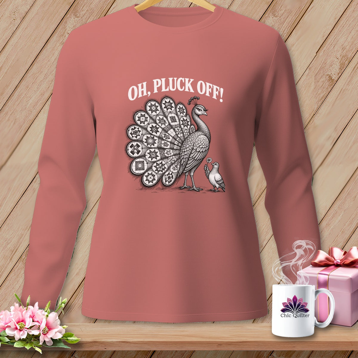 Dusty rose long-sleeve t-shirt with a vintage peacock graphic and the text OH, PLUCK OFF!