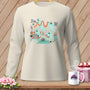Ghosts sewing and quilting on a cream long-sleeve shirt.