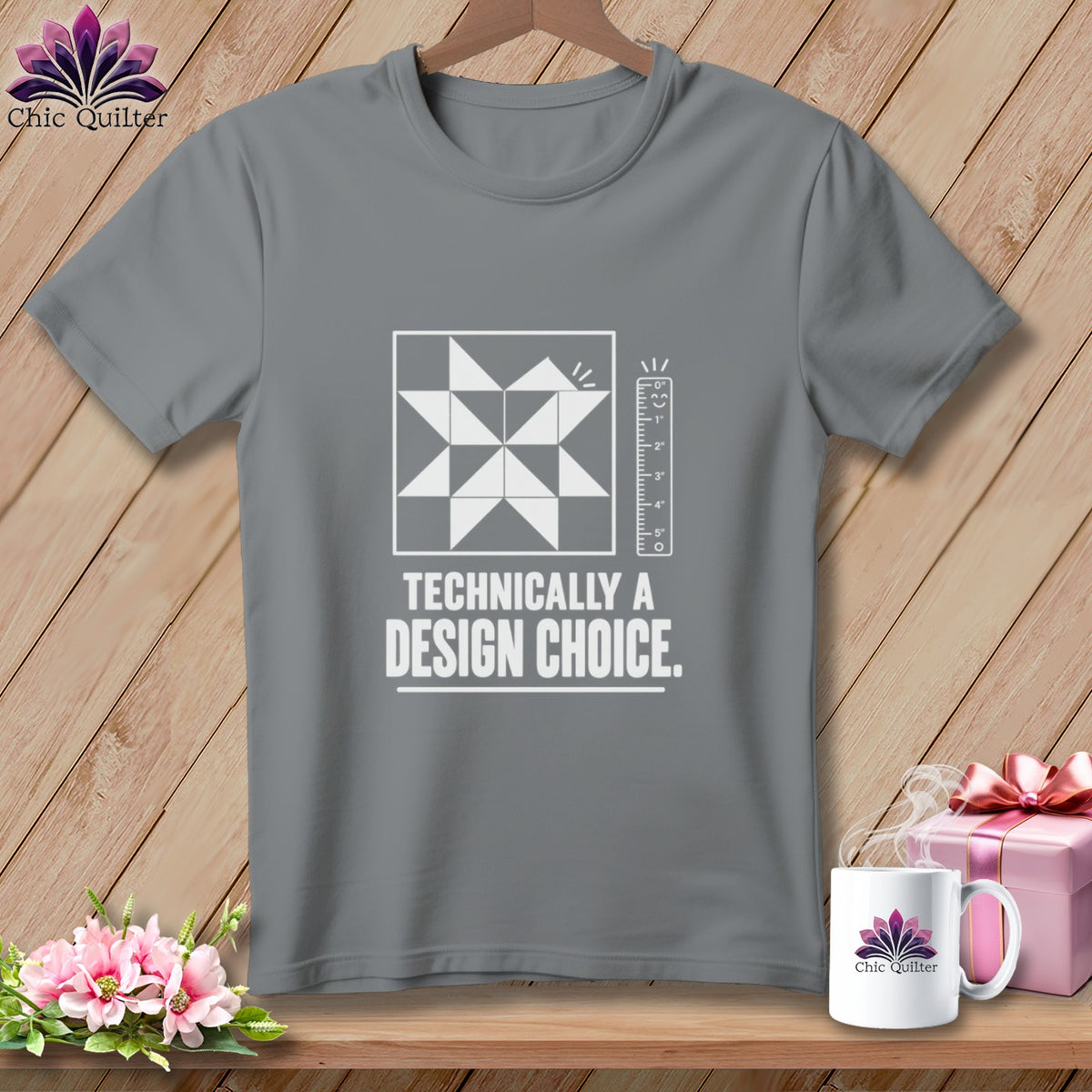 Gray t-shirt with "Technically a Design Choice" text and quilting graphic.