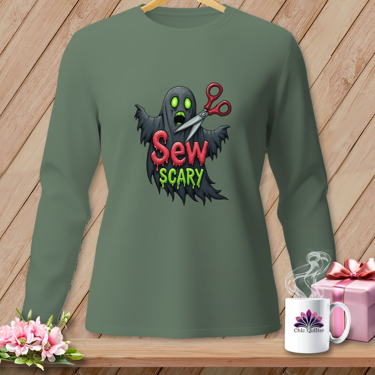 Green long-sleeve shirt with ghost and scissors graphic reading "Sew Scary."