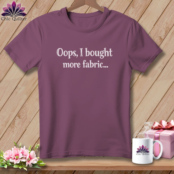 Plum t-shirt with white text "Oops, I bought more fabric...".