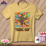 Yellow t-shirt with a witch riding a ruler with bats and text 