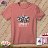 Pink t-shirt with a graphic of a folded quilt and text 
