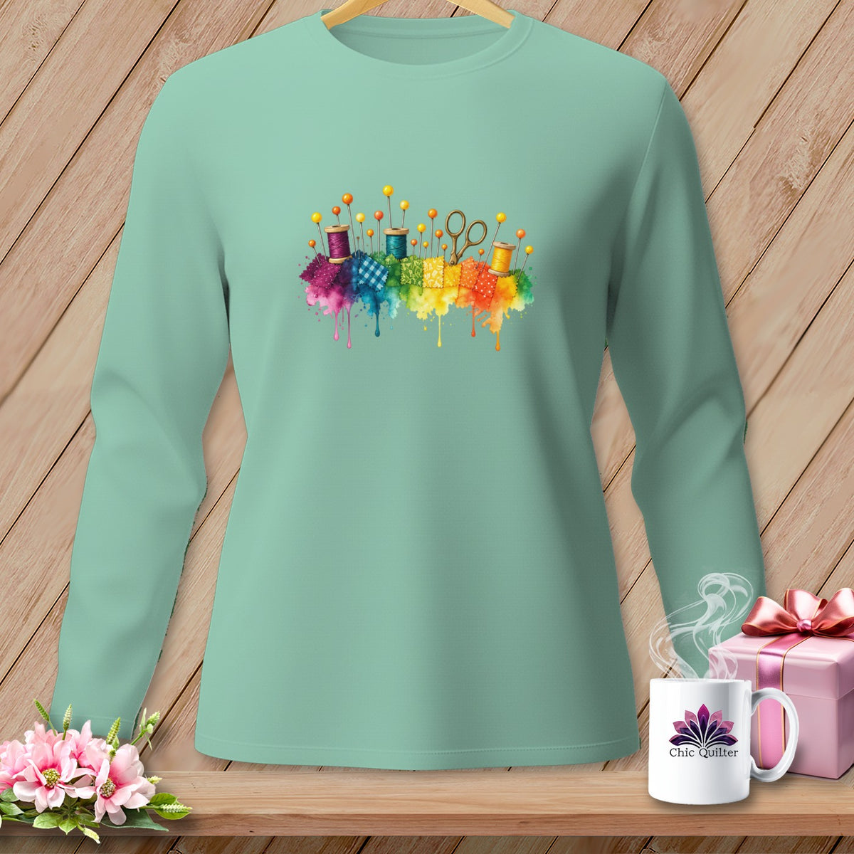 Long-sleeve mint green shirt with watercolor sewing notions design and "Chic Quilter" mug.