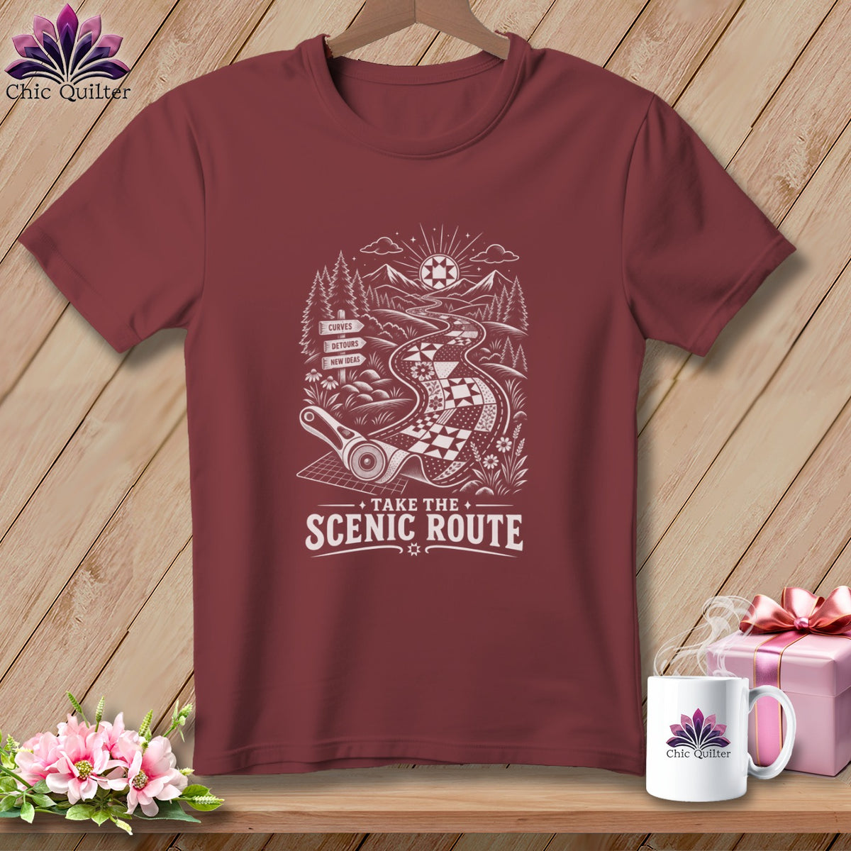 Maroon t-shirt with "Take the Scenic Route" text and quilting road design.