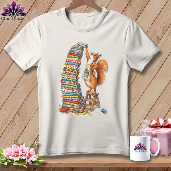 Squirrel in apron stacking fabric on a stool with sewing notions.