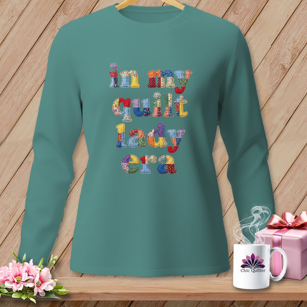 Teal long sleeve shirt with "in my quilt lady era" in patchwork letters.