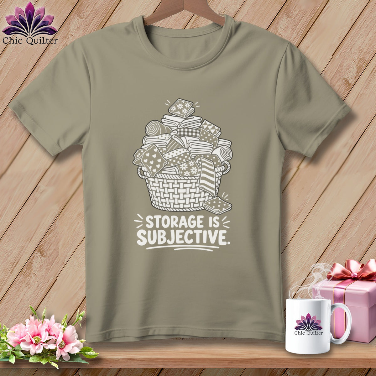 T-shirt with basket overflowing with folded fabric and text "STORAGE IS SUBJECTIVE."
