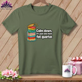 Olive green t-shirt featuring a graphic of folded fabric in a jar with text.