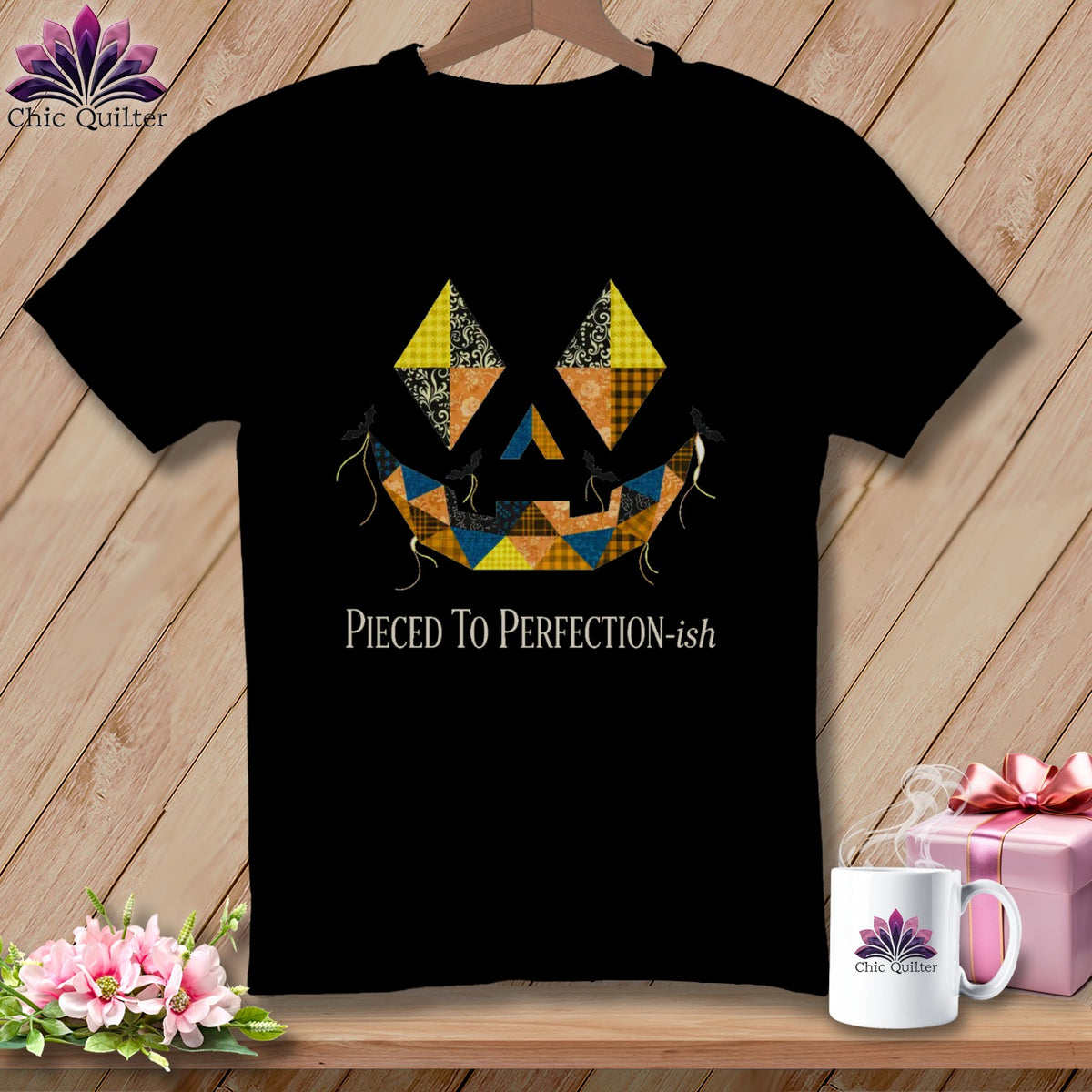 Black t-shirt with a patchwork jack-o-lantern face and "Pieced To Perfection-ish" text.
