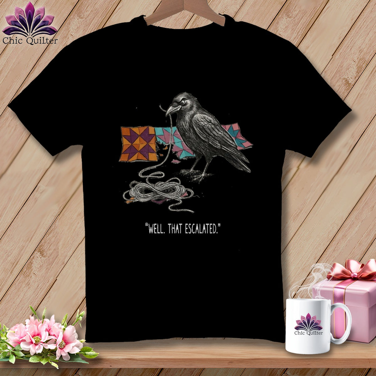 Black t-shirt with a raven, yarn, and quote "WELL. THAT ESCALATED."