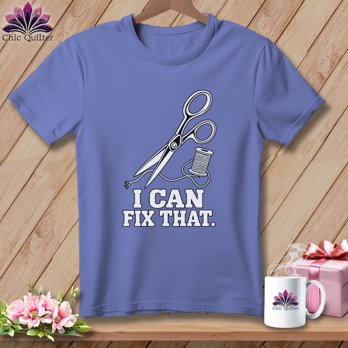 Purple t-shirt with scissors, thread, and "I CAN FIX THAT" text.