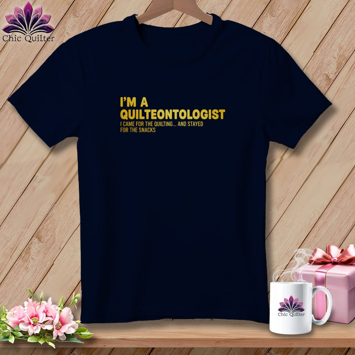 Navy t-shirt with "I'm a Quilteontologist" text and humorous quilting quote.