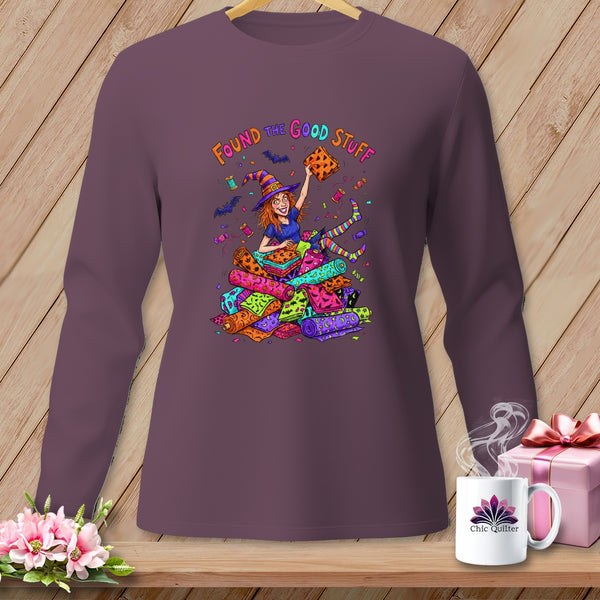 Witch holding fabric rolls with "Found the Good Stuff" text.