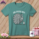 Teal t-shirt featuring a black and white illustration of a peacock, a smaller bird, and the text OH, PLUCK OFF!
