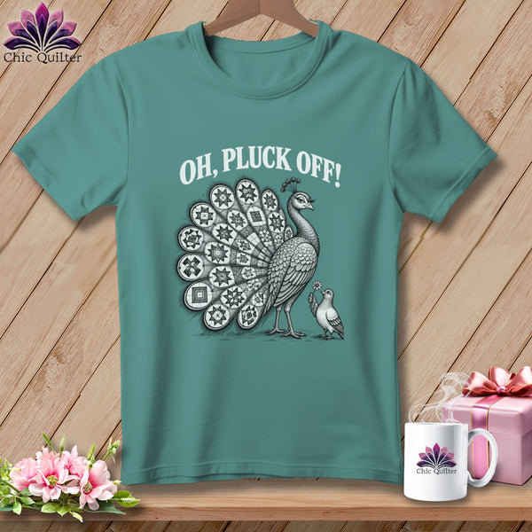 Teal t-shirt featuring a black and white illustration of a peacock, a smaller bird, and the text OH, PLUCK OFF!