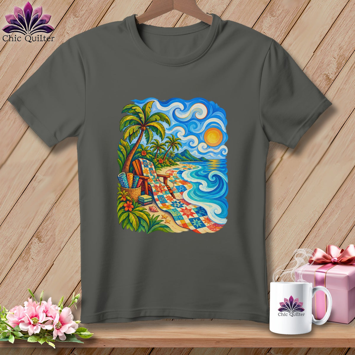 Dark gray crewneck t-shirt featuring a colorful tropical beach scene with a quilted blanket and palm trees.