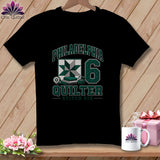 Black t-shirt featuring Philadelphia Quilter graphics with a green star quilt block and the number 6.