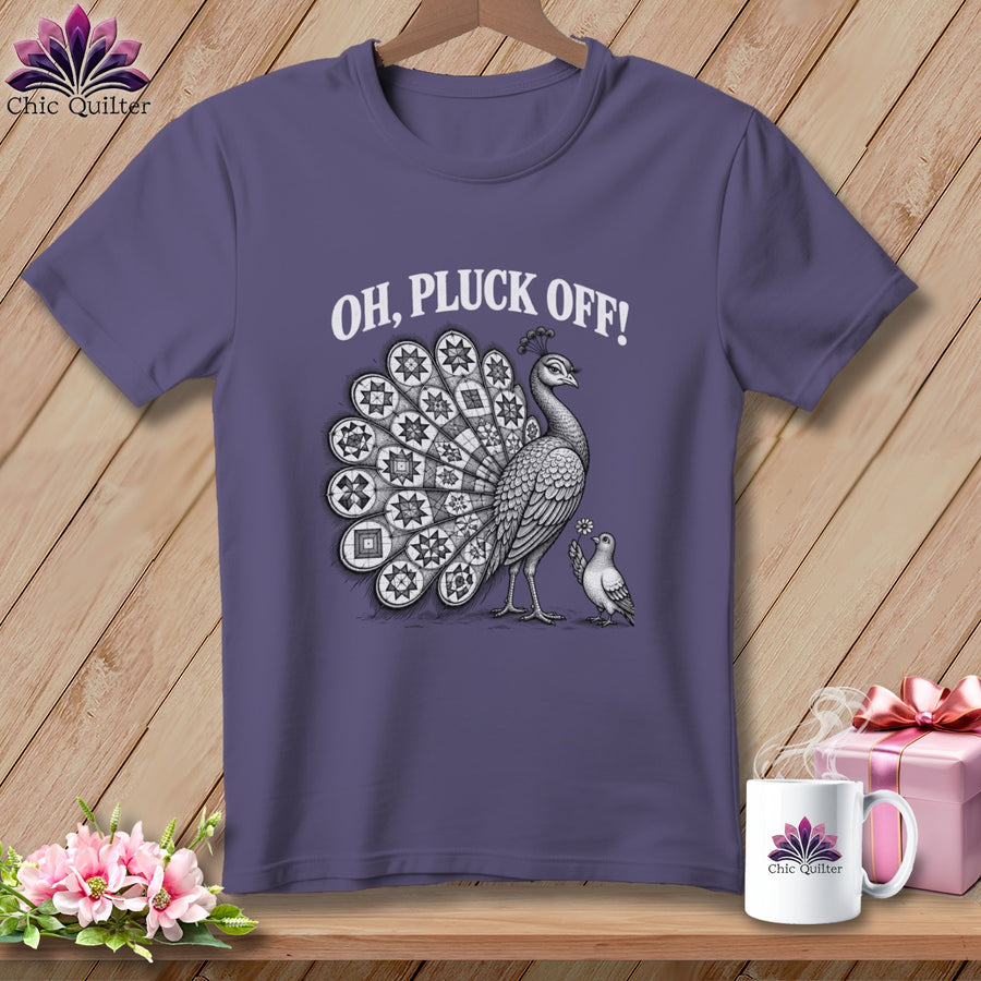 Purple t-shirt featuring a black and white illustration of a peacock, a dove, and the text Oh, Pluck Off!