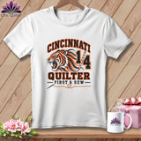 A white crewneck t-shirt featuring a Cincinnati Quilter design with a roaring tiger illustration and text.