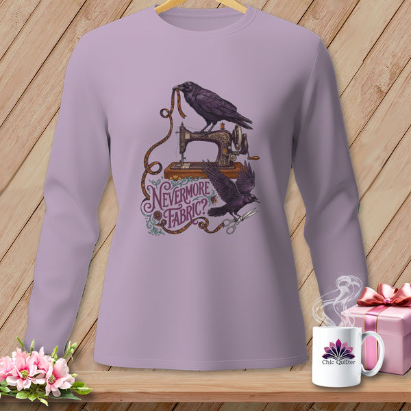 Ravens on sewing machine with "Nevermore Fabric?" text and scissors on a light purple shirt.