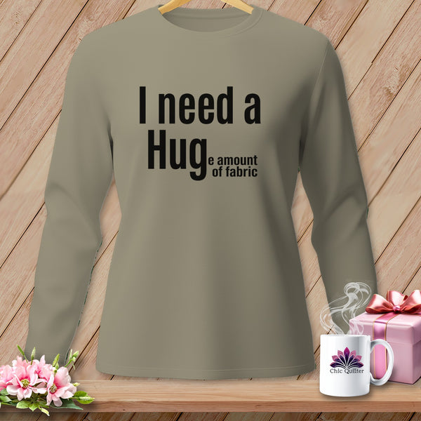 T-shirt with black text "I need a Hug e amount of fabric".