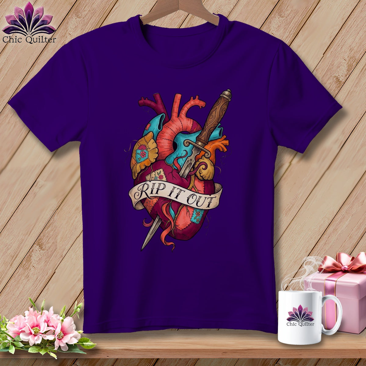 Purple t-shirt with anatomical heart, dagger, and ribbon that reads "Rip It Out".