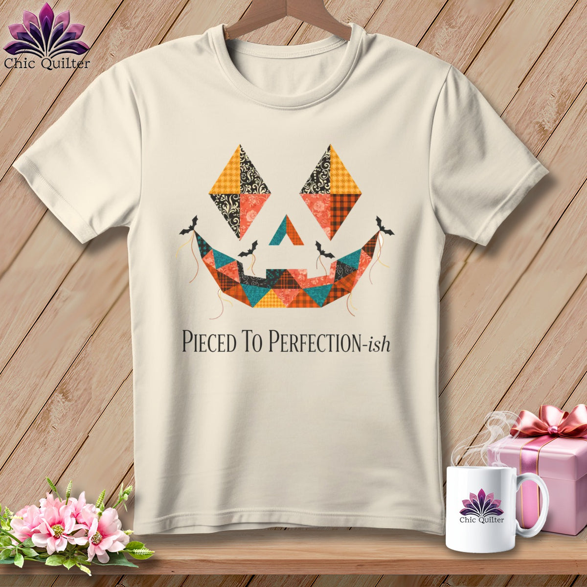 Cream t-shirt with a patchwork jack-o'-lantern face and the text "Pieced To Perfection-ish".