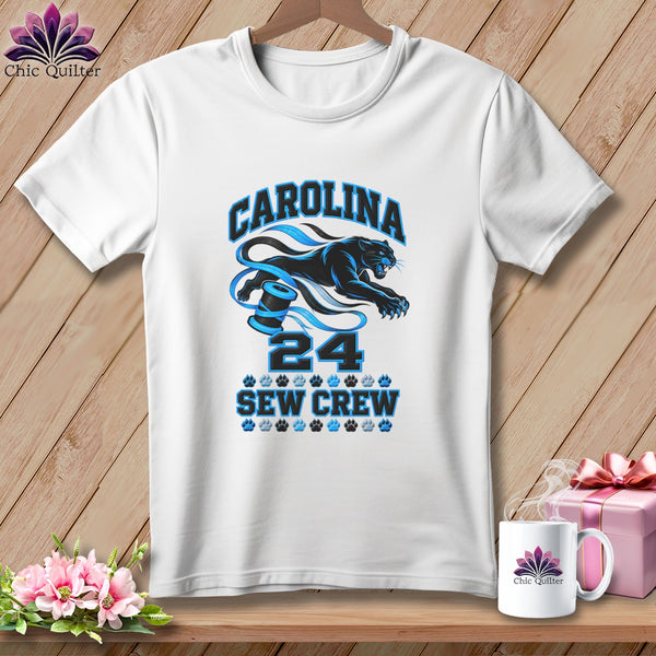 White crewneck t-shirt featuring a blue panther graphic, spool of thread, and Carolina Sew Crew text.
