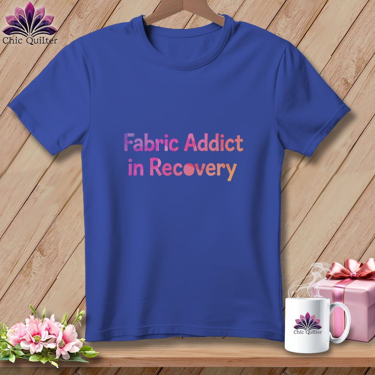 Blue t-shirt with text "Fabric Addict in Recovery" and Chic Quilter logo.