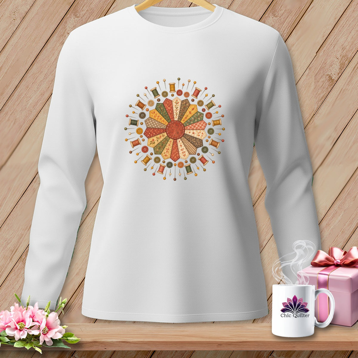 White long-sleeved shirt with a circular quilt-themed print featuring spools and buttons.