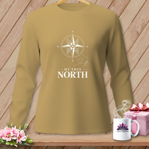 Long-sleeved tan shirt with white compass design and text "MY TRUE NORTH".