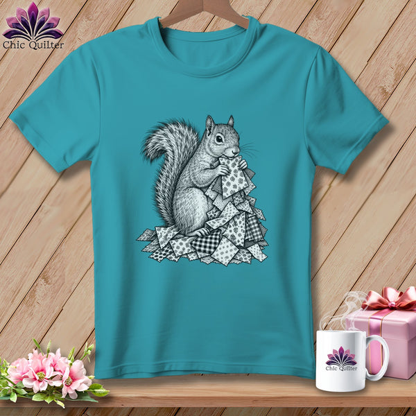 Turquoise crewneck t-shirt featuring a black-and-white graphic of a squirrel holding patterned fabric scraps.