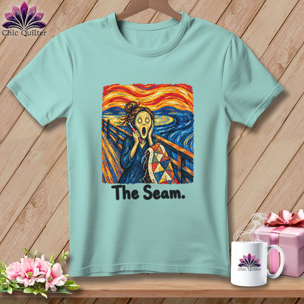 Mint green t-shirt featuring "The Scream" artwork with quilting theme and text "The Seam."