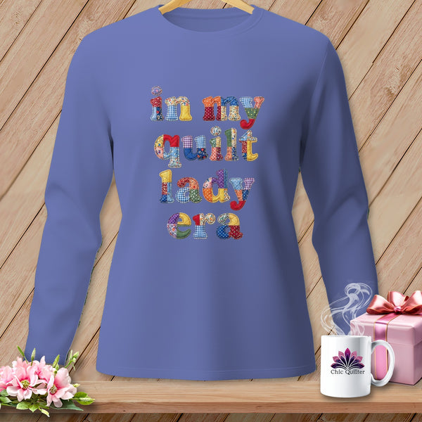 Long-sleeve shirt with "in my quilt lady era" text in patchwork letters.