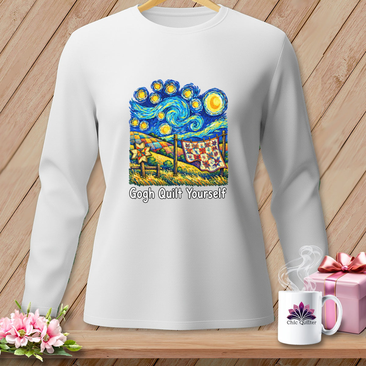 White long-sleeve shirt with a "Gogh Quilt Yourself" graphic depicting a quilt hanging outdoors under a starry sky.