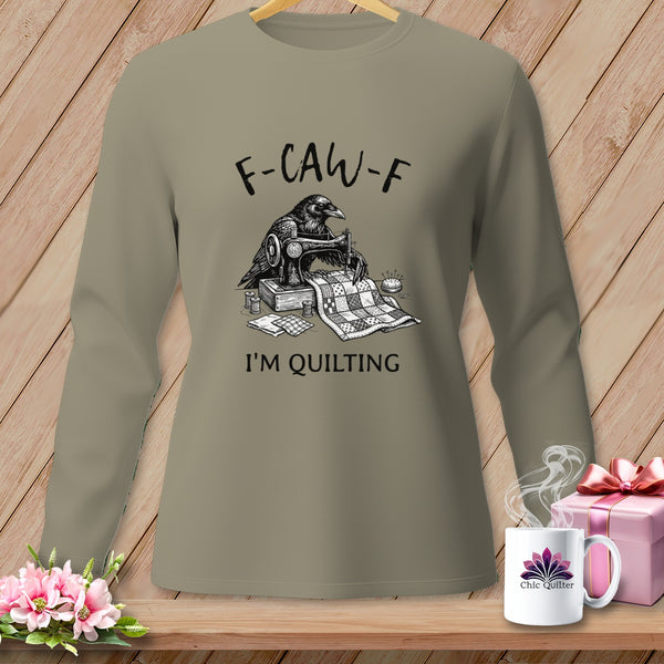 Long-sleeve shirt with a raven sewing a quilt, "F-CAW-F I'M QUILTING" text.