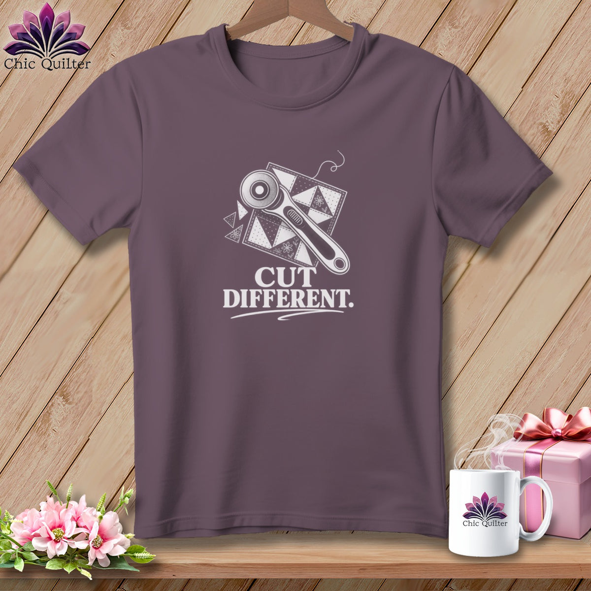 Purple t-shirt with rotary cutter and patchwork design, reads "CUT DIFFERENT."
