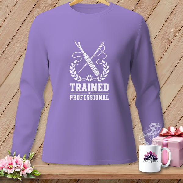 Lavender long-sleeve shirt with "Trained Professional" sewing graphic.