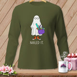 Green long-sleeve shirt featuring a ghost wearing glasses and carrying sewing supplies with 