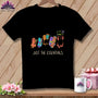 Black t-shirt with colorful ghosts holding sewing supplies and text "JUST THE ESSENTIALS."